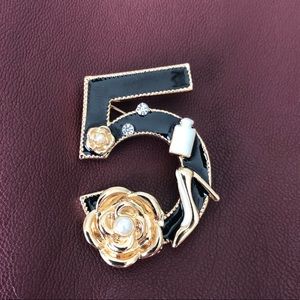 Chanel-like brooch in gold and black&white enamel